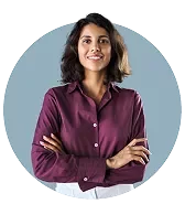 a woman smiling with crossed arms